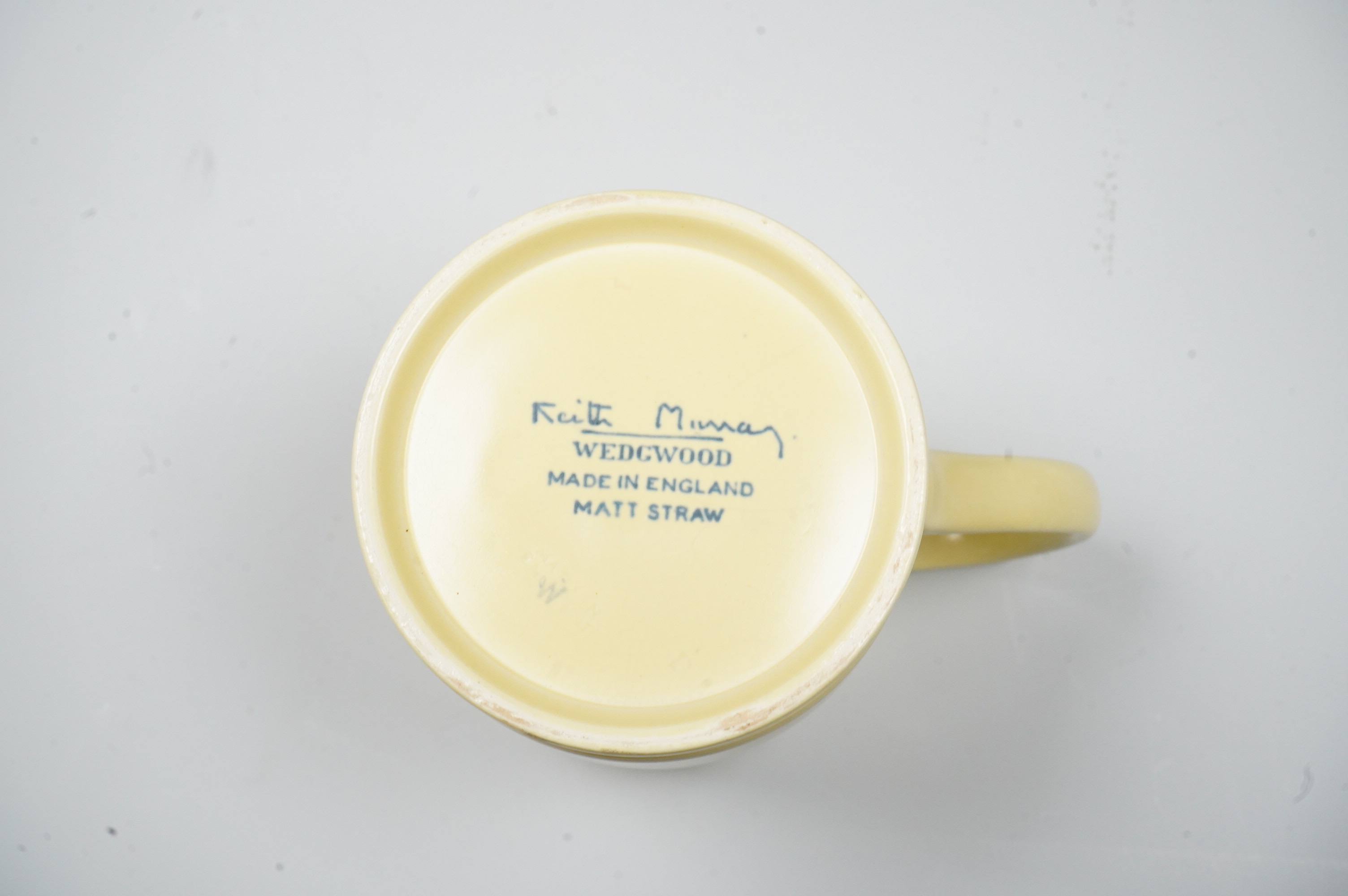 A Keith Murray Wedgwood mug in matt straw, 12cm